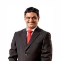 Dr. George John
